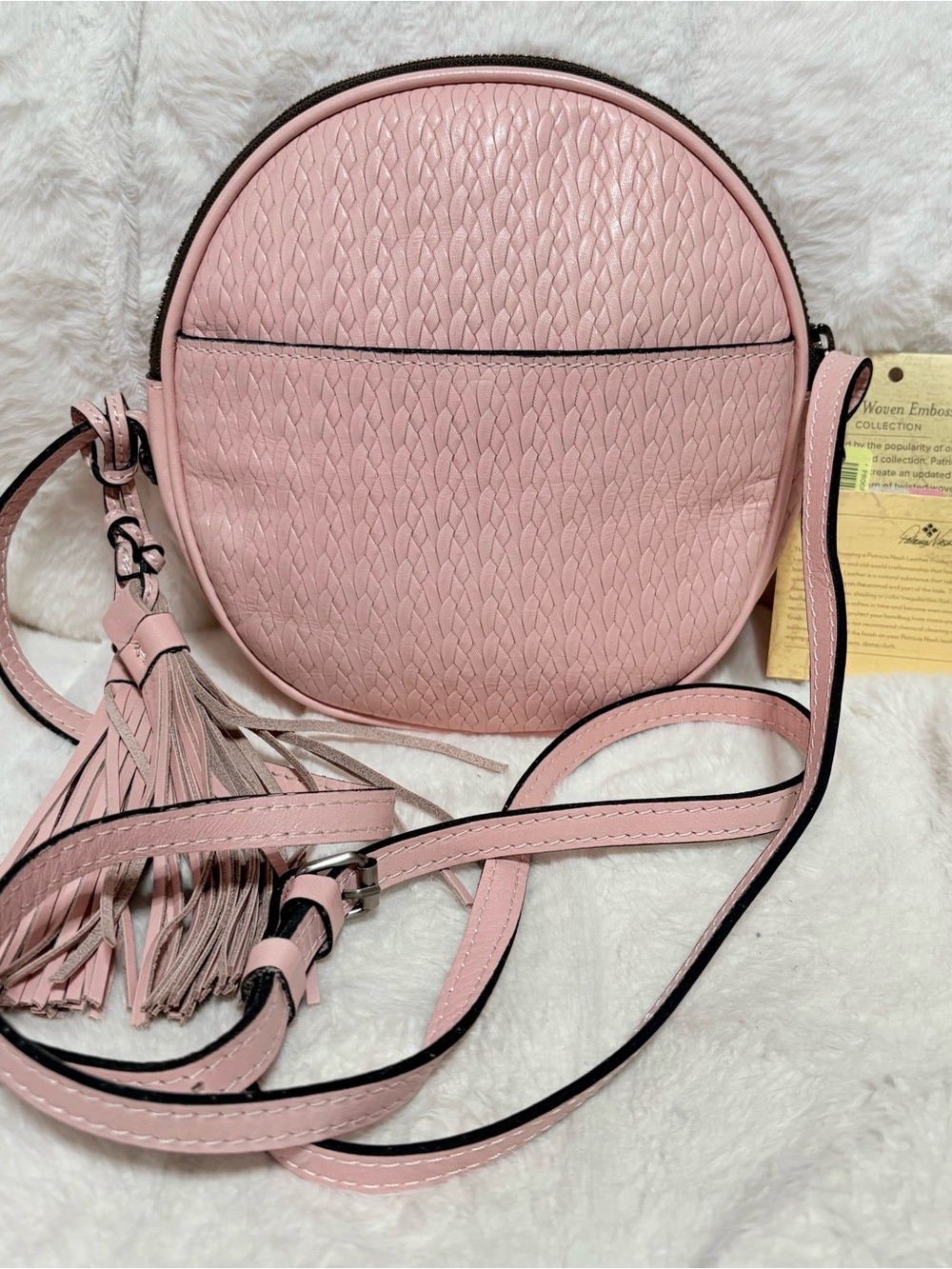 Patricia Nash Twisted Woven Scafati Crossbody bag in a pastel pink color